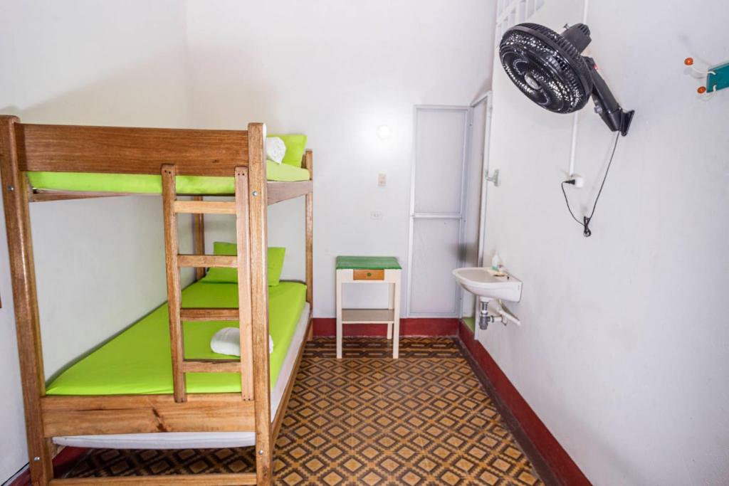 Postel nebo postele na pokoji v ubytování Hotel Kasa Dokari