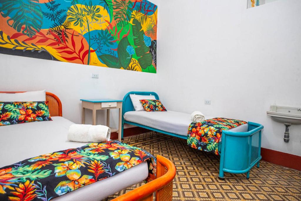 Postel nebo postele na pokoji v ubytování Hotel Kasa Dokari