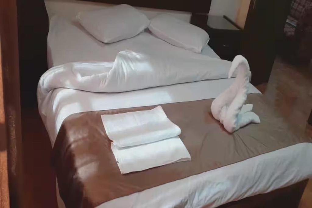 Postel nebo postele na pokoji v ubytování Al-Nujoom Hotel Suites