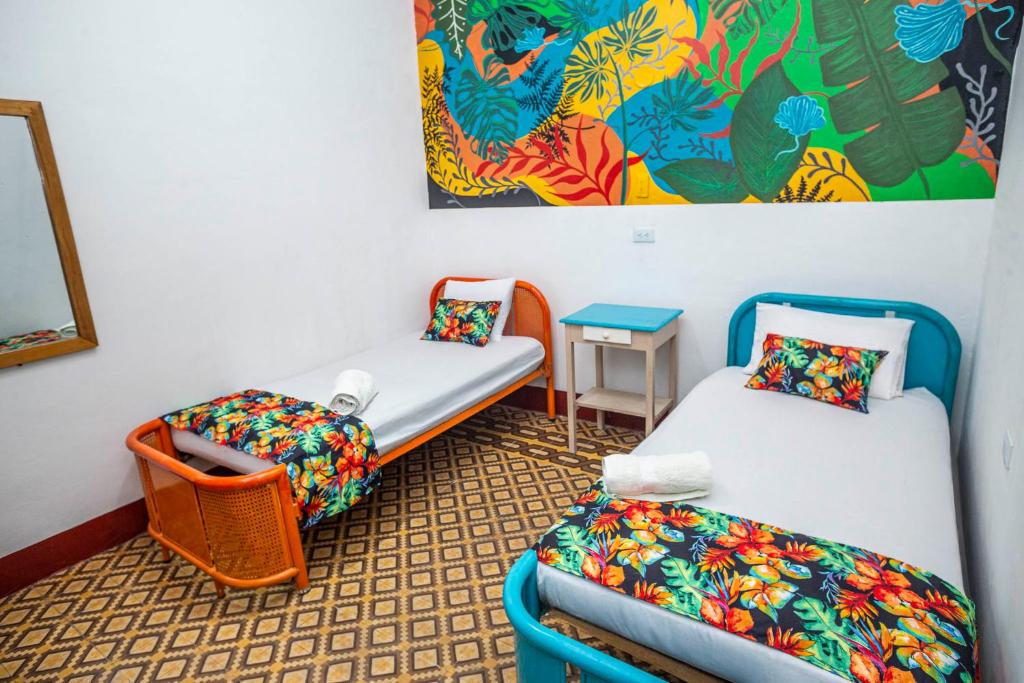 Postel nebo postele na pokoji v ubytování Hotel Kasa Dokari