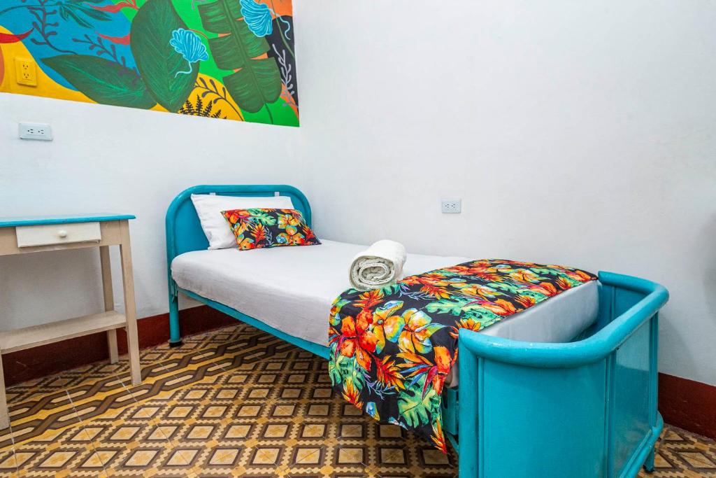 Postel nebo postele na pokoji v ubytování Hotel Kasa Dokari