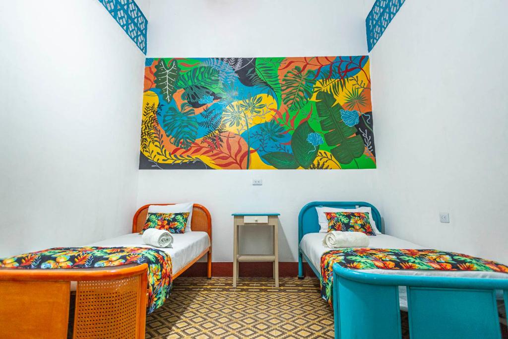 Postel nebo postele na pokoji v ubytování Hotel Kasa Dokari