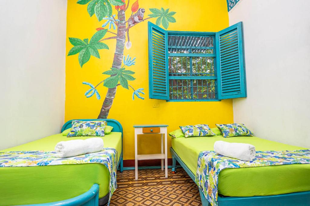 Postel nebo postele na pokoji v ubytování Hotel Kasa Dokari