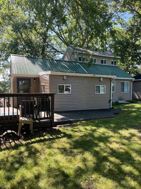 a small house with a porch and a yard at Lazy Lake Life Awaits! in Monticello