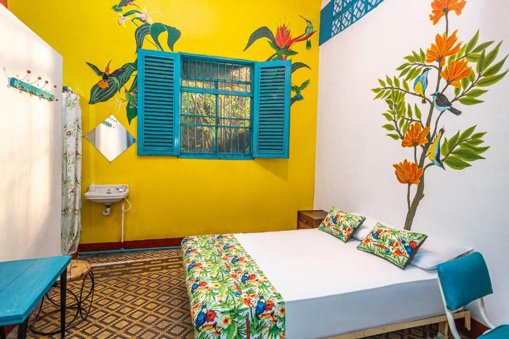 Postel nebo postele na pokoji v ubytování Hotel Kasa Dokari