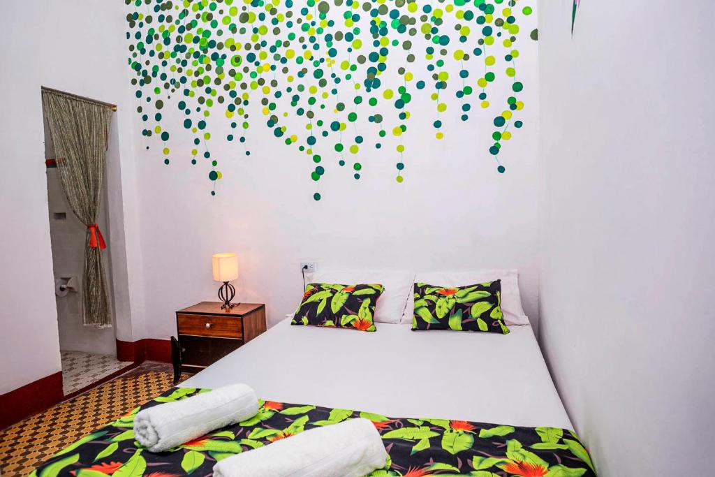 Postel nebo postele na pokoji v ubytování Hotel Kasa Dokari