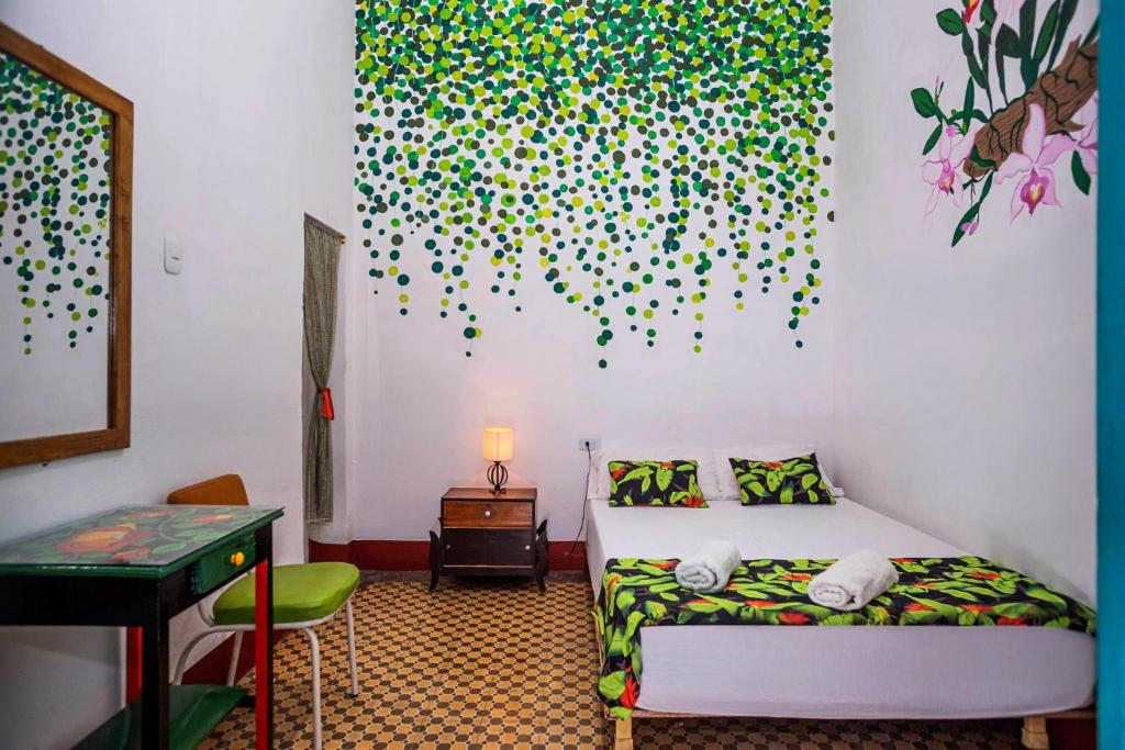Postel nebo postele na pokoji v ubytování Hotel Kasa Dokari