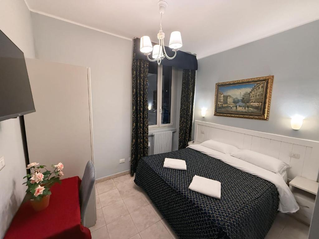 Postel nebo postele na pokoji v ubytování Hotel Aurelia Milano Centrale