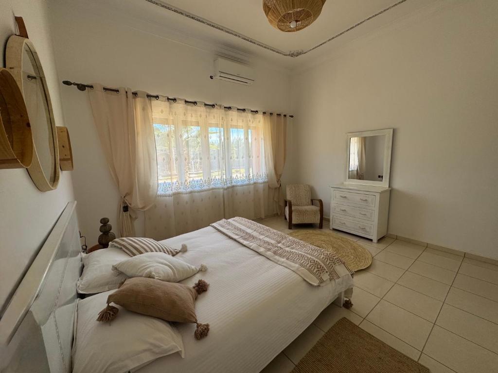Postel nebo postele na pokoji v ubytování Maison Jannate Louise
