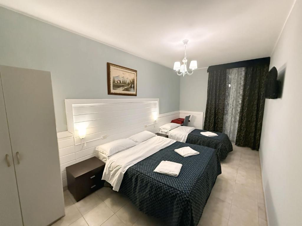 Postel nebo postele na pokoji v ubytování Hotel Aurelia Milano Centrale