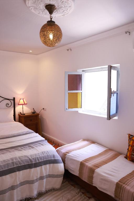 Postel nebo postele na pokoji v ubytování Maison Imane Marrakech
