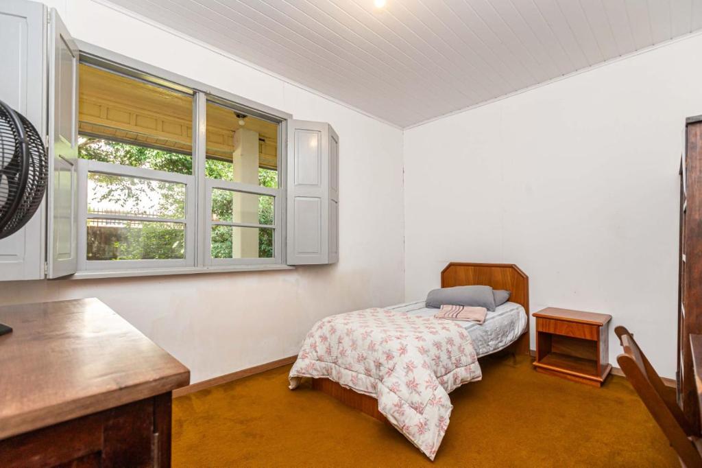 Postel nebo postele na pokoji v ubytování Memora Guesthouse Curitiba - Quartos em Casa próximo ao Parque Bacacheri