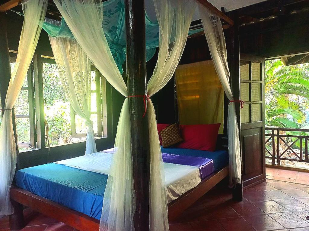 Postel nebo postele na pokoji v ubytování Jungle House Kep