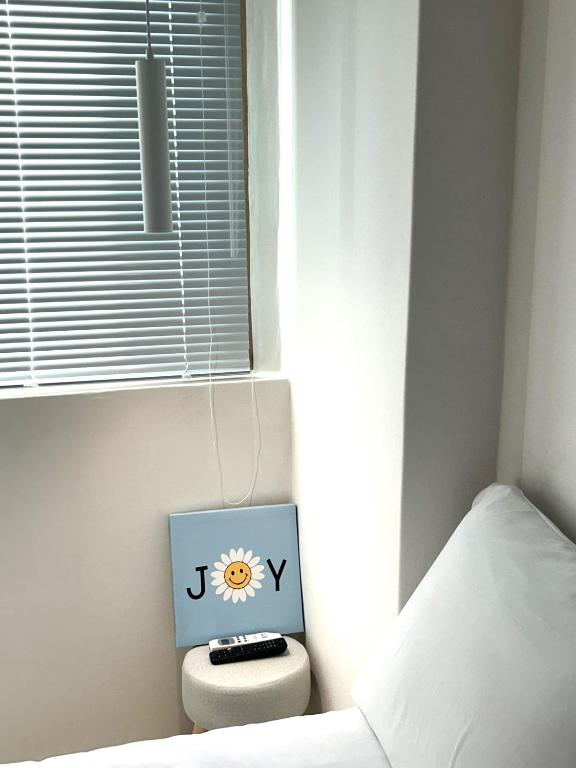 Postel nebo postele na pokoji v ubytování Busan Circle Stay Hotel