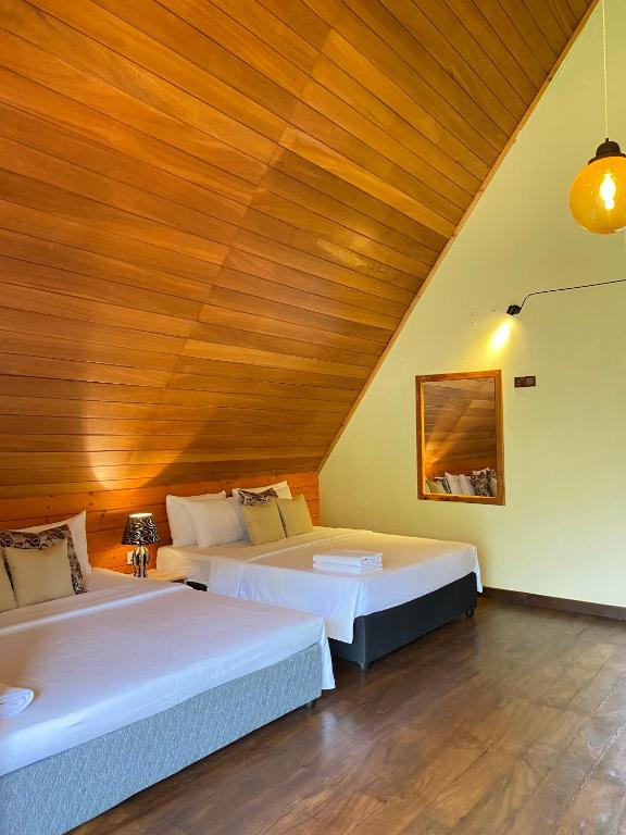 Postel nebo postele na pokoji v ubytování Avons Residence Hanthana