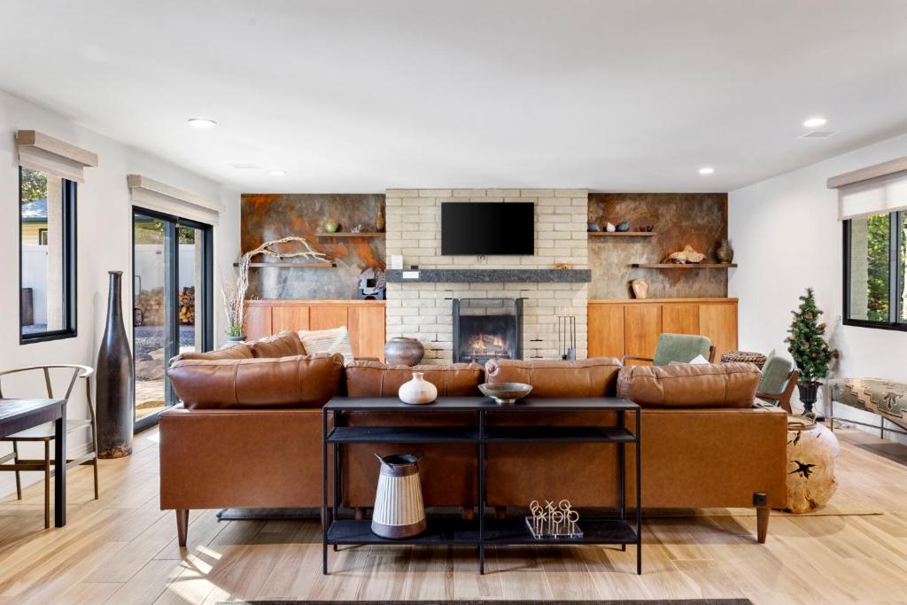 a living room with a couch and a fireplace at Boulder Bungalow in Prescott