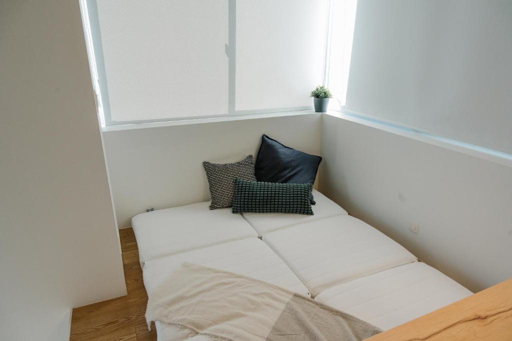 Postel nebo postele na pokoji v ubytování Tokyo Cabin