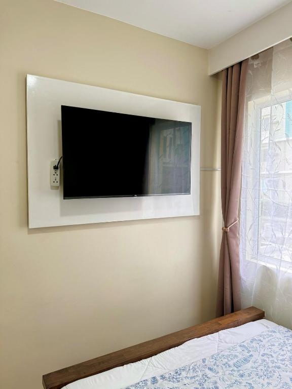 TV a/nebo společenská místnost v ubytování Lene Condominium Unit Rental