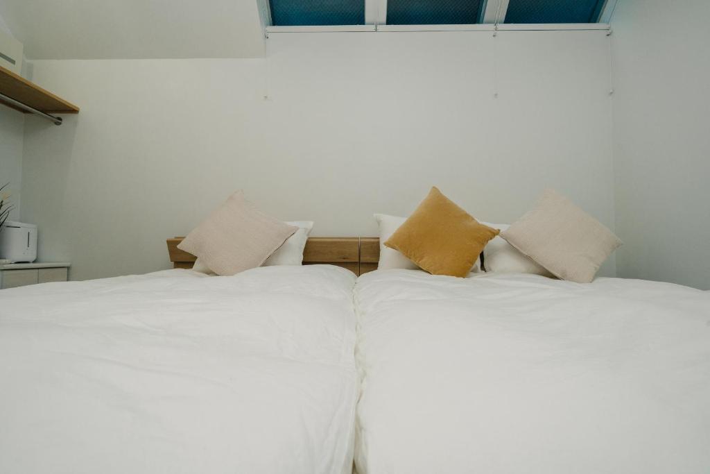 Postel nebo postele na pokoji v ubytování Tokyo Cabin