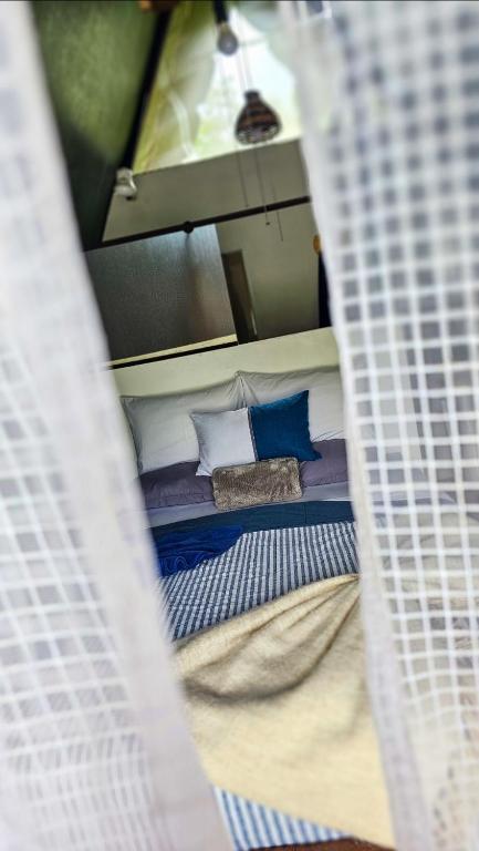 Postel nebo postele na pokoji v ubytování Flora Glamping de Abuela