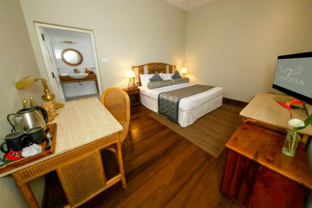 Postel nebo postele na pokoji v ubytování Castle Hill Bungalow