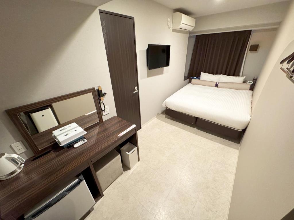 Postel nebo postele na pokoji v ubytování RE Hotel 谷町9丁目2