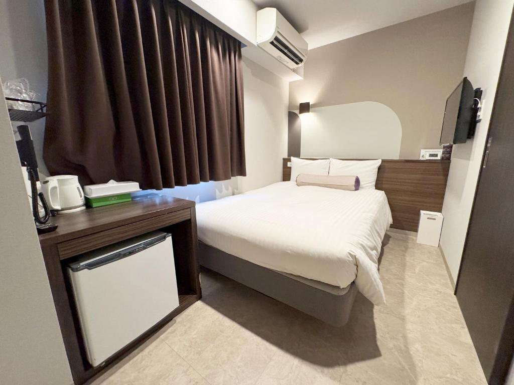 Postel nebo postele na pokoji v ubytování RE Hotel 谷町9丁目2