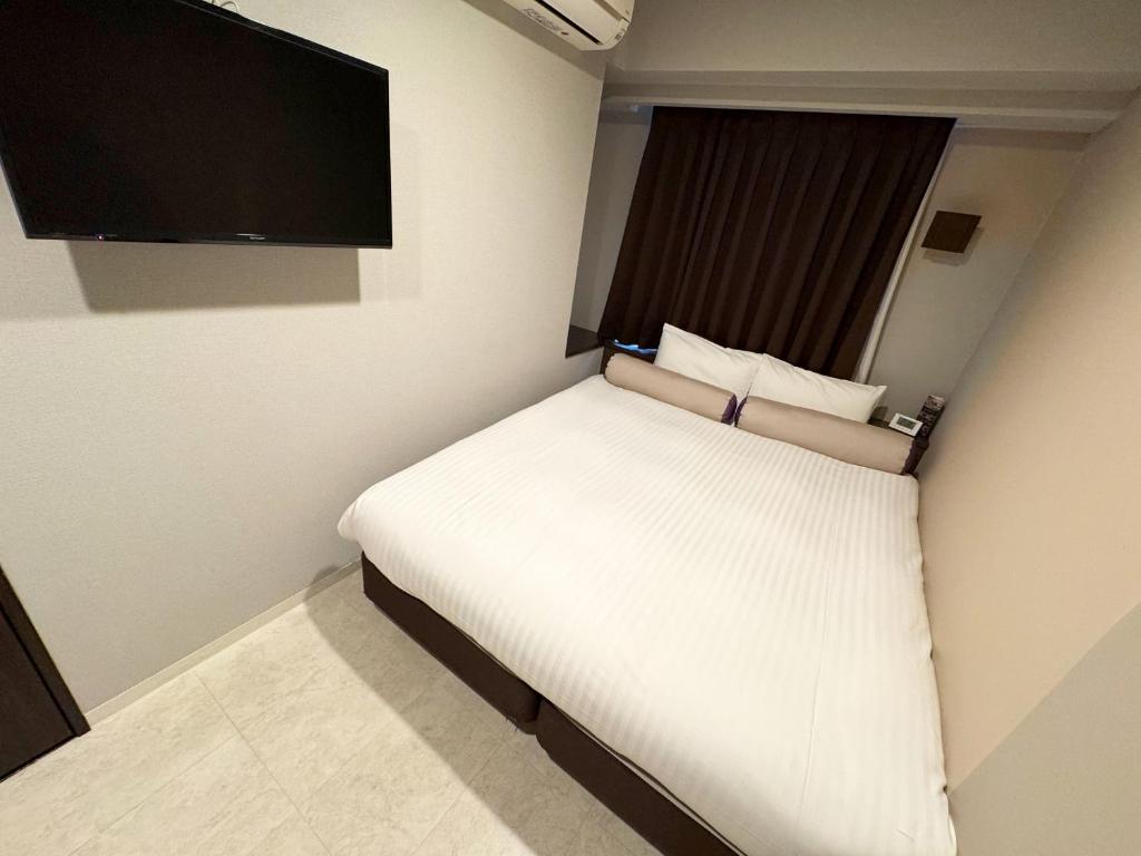 Postel nebo postele na pokoji v ubytování RE Hotel 谷町9丁目2