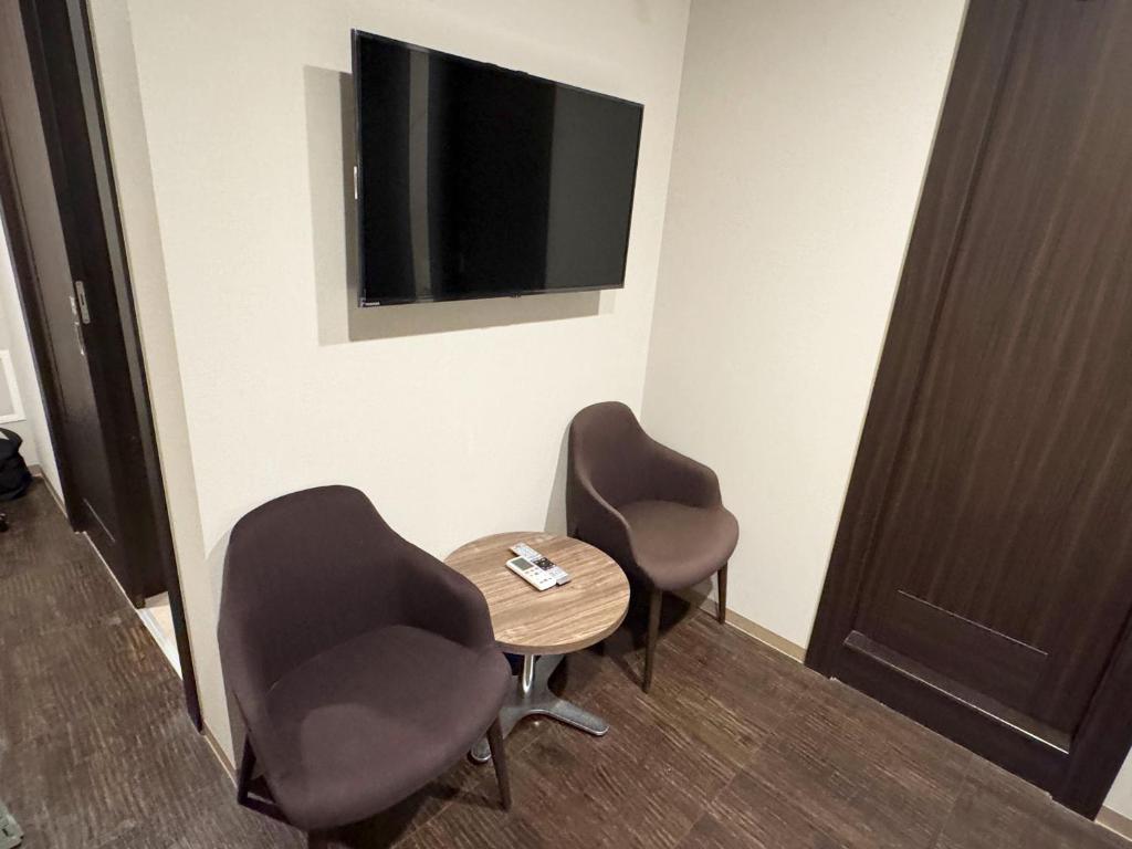 TV a/nebo společenská místnost v ubytování RE Hotel 谷町9丁目2