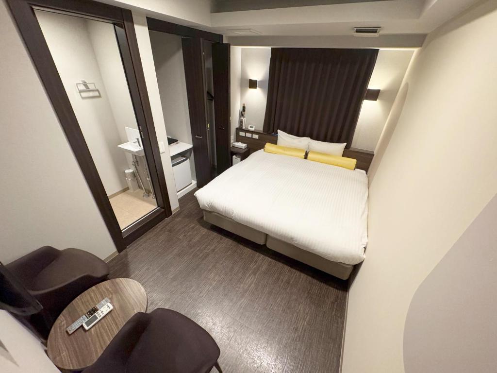 Postel nebo postele na pokoji v ubytování RE Hotel 谷町9丁目2