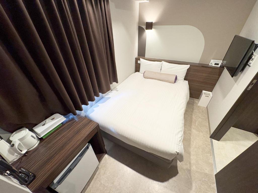 Postel nebo postele na pokoji v ubytování RE Hotel 谷町9丁目2