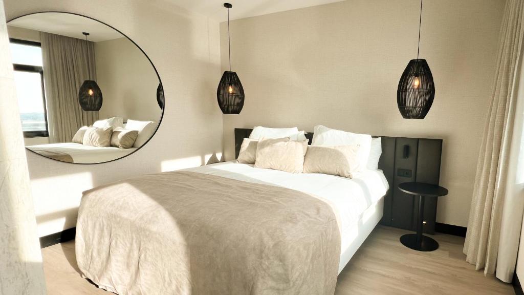 Postel nebo postele na pokoji v ubytování Van der Valk Hotel Houten Utrecht