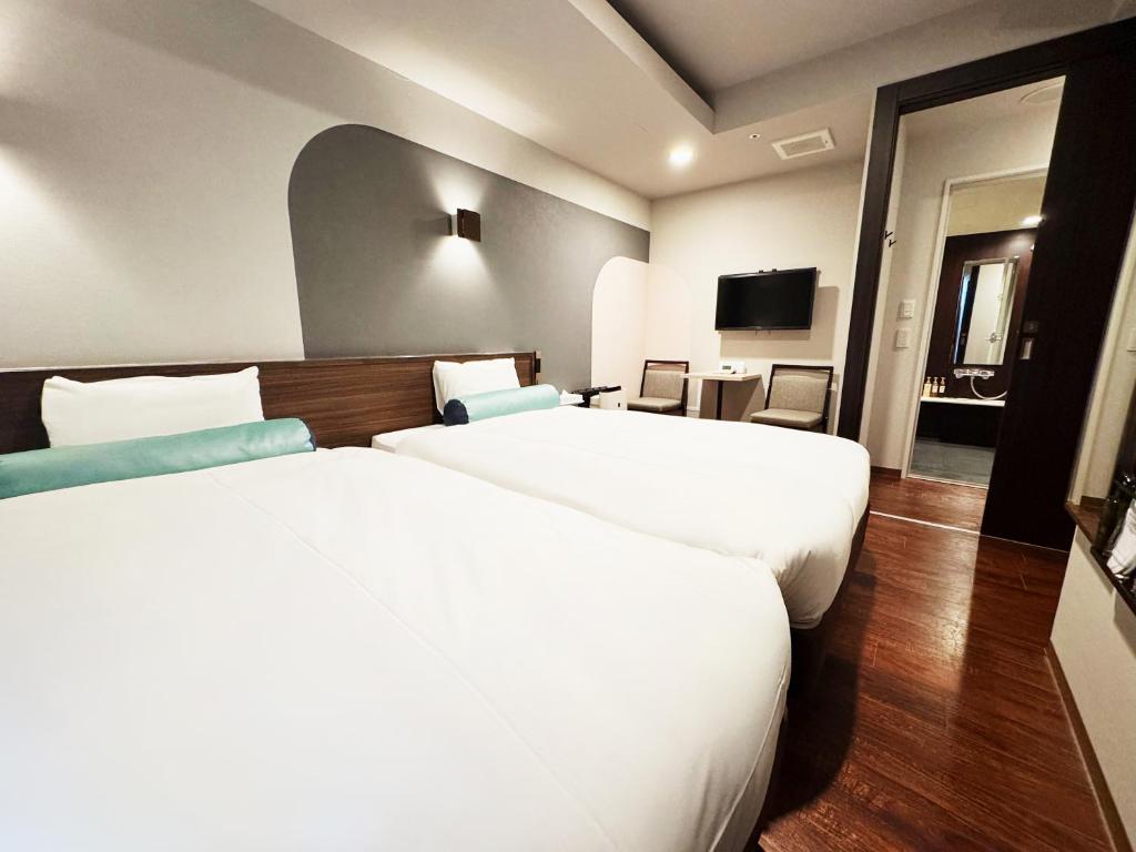 Postel nebo postele na pokoji v ubytování RE Hotel 谷町9丁目2