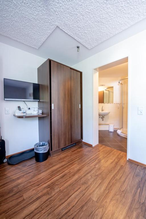 Postel nebo postele na pokoji v ubytování Garni Hotel Henn
