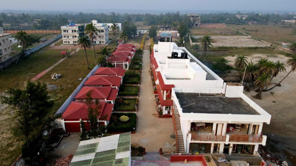 an aerial view of a building with red roofs at Ricardo Beach Resort in Mandarmoni