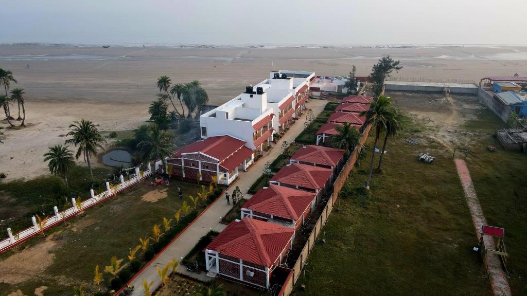 an overhead view of a row of houses with red roofs at Ricardo Beach Resort in Mandarmoni