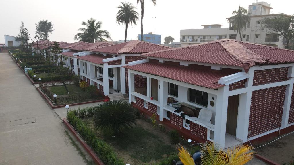 an overhead view of a row of houses with red roofs at Ricardo Beach Resort in Mandarmoni