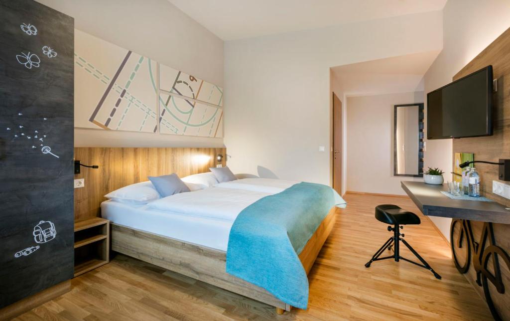 Postel nebo postele na pokoji v ubytování JUFA Hotel Erlaufsee