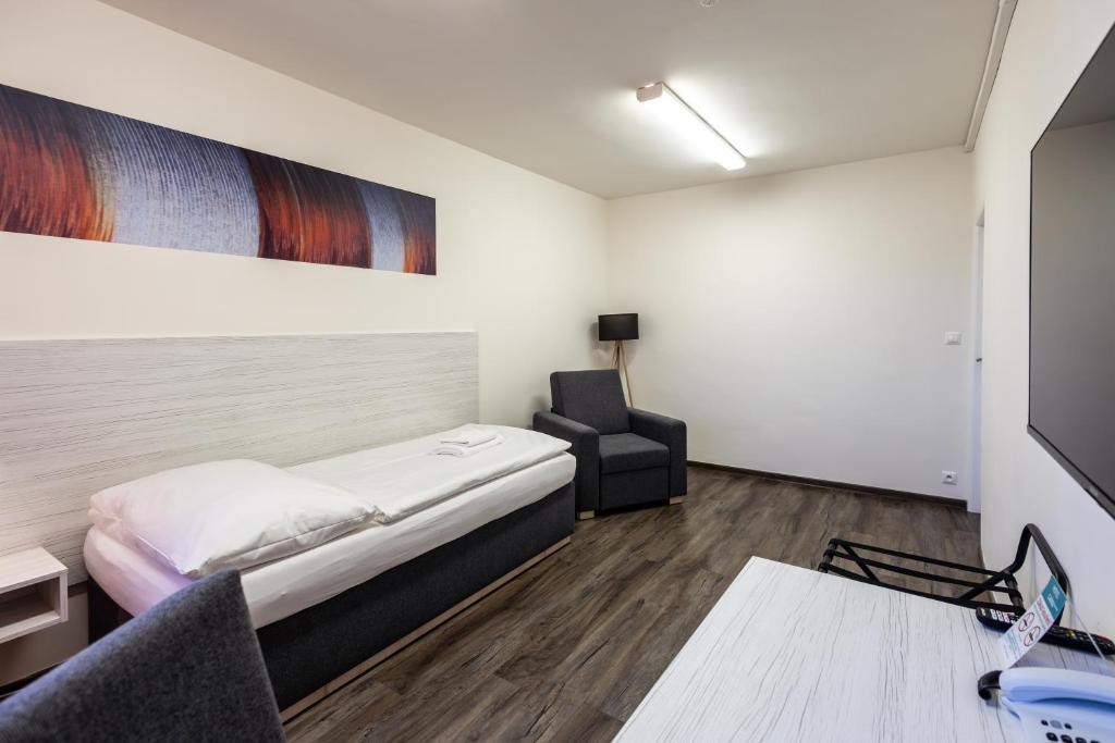 Postel nebo postele na pokoji v ubytování Hotel Garni VŠB TUO