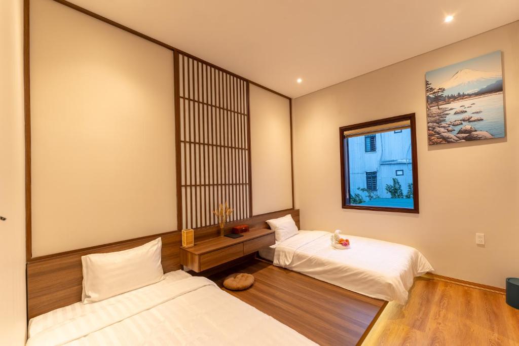 Giường trong phòng chung tại Su'e homestay