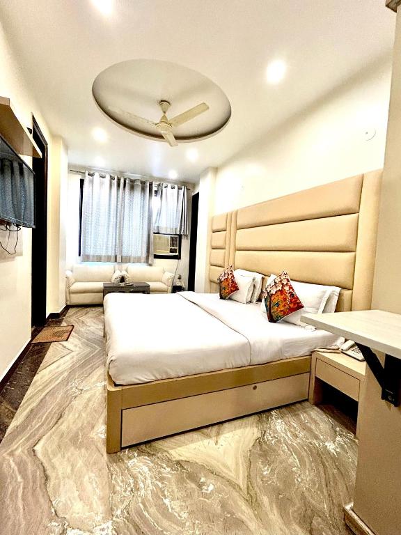 Postel nebo postele na pokoji v ubytování Hotel Amrit Villa