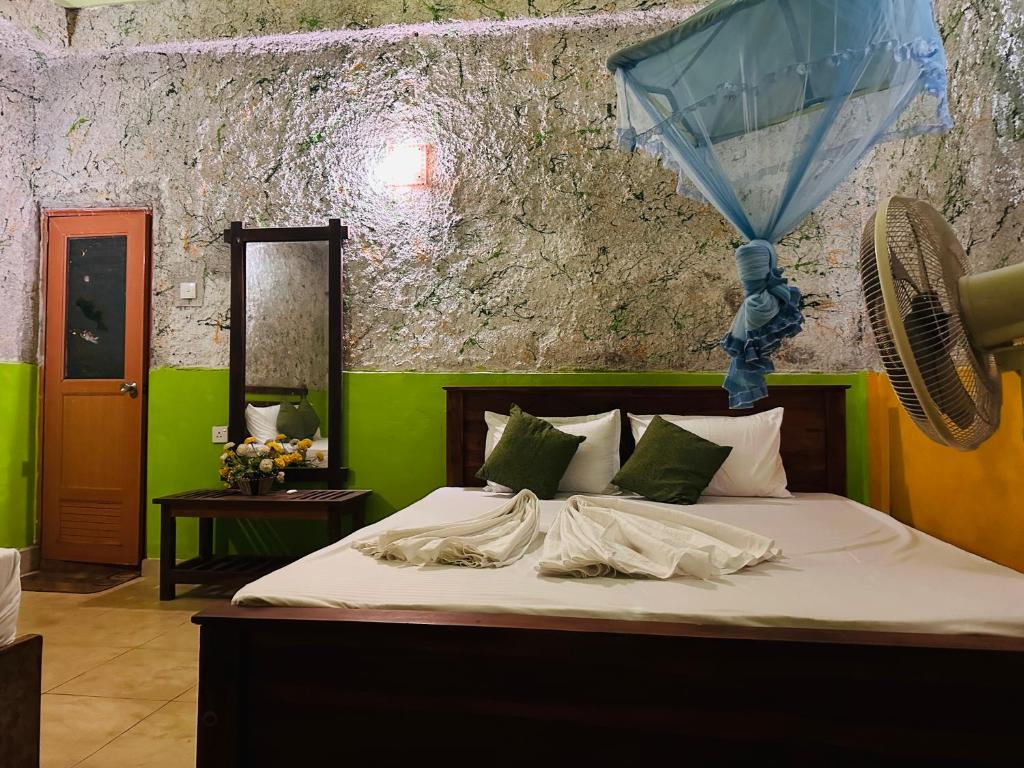 Postel nebo postele na pokoji v ubytování Sigiriya Vee Guest