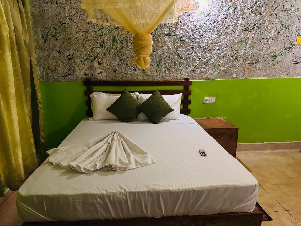 Postel nebo postele na pokoji v ubytování Sigiriya Vee Guest