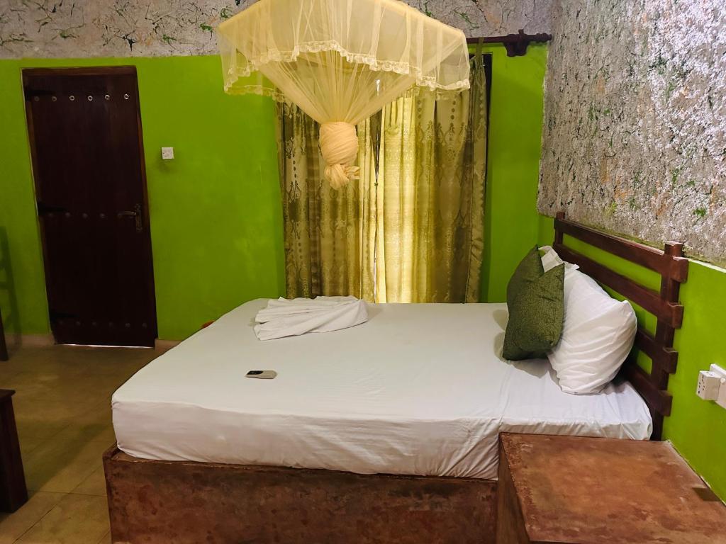 Postel nebo postele na pokoji v ubytování Sigiriya Vee Guest