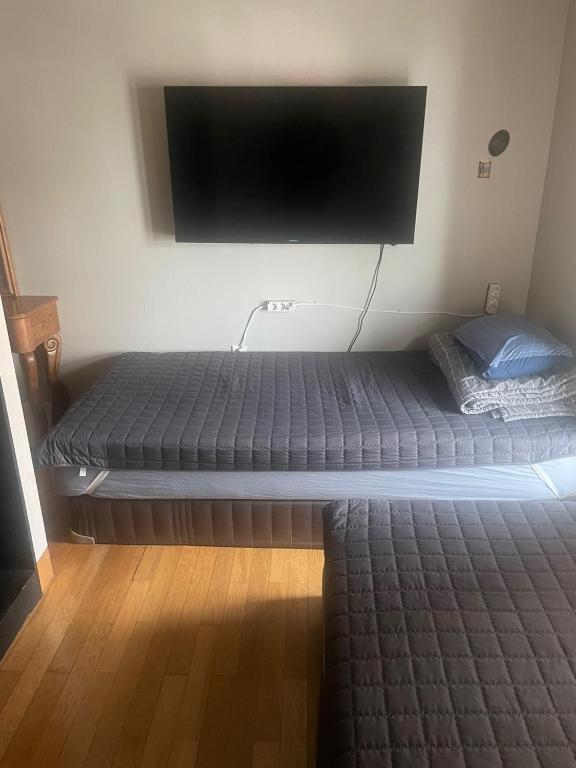 Postel nebo postele na pokoji v ubytování Lyndon Guesthouse
