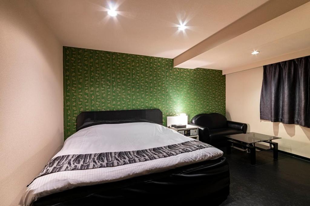 Postel nebo postele na pokoji v ubytování HOTEL Mai Sakura ADULT ONLY