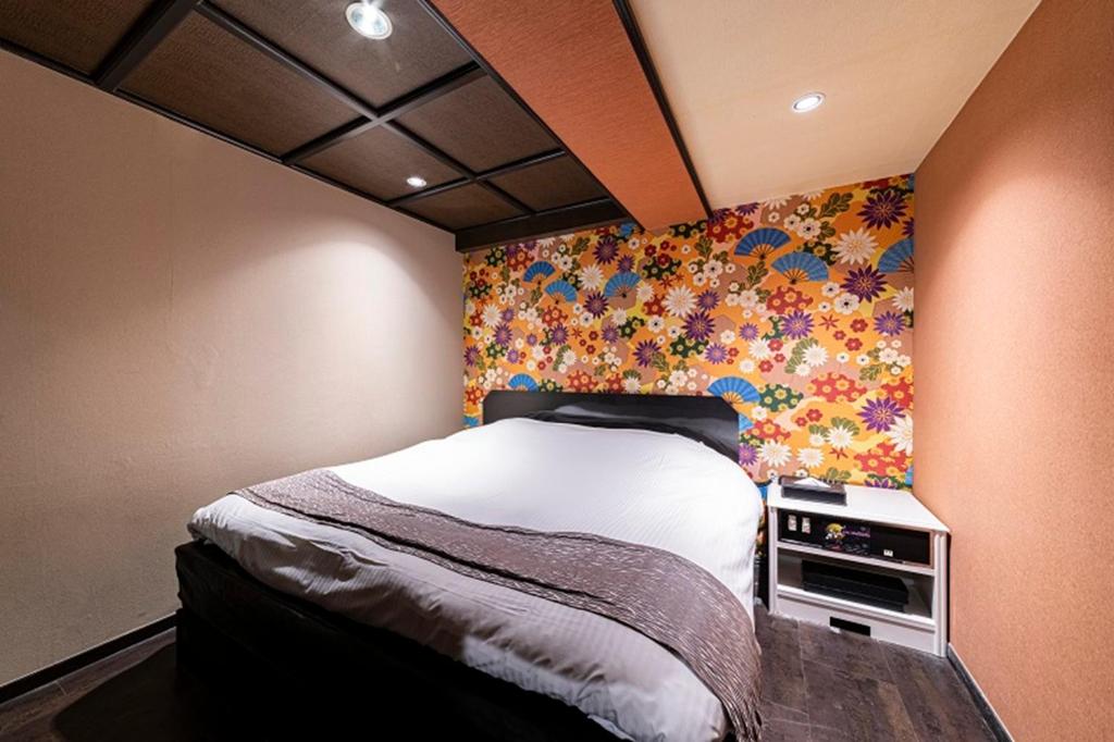 Postel nebo postele na pokoji v ubytování HOTEL Mai Sakura ADULT ONLY