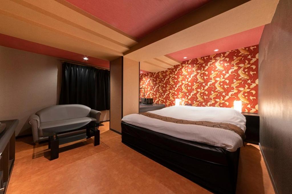 Postel nebo postele na pokoji v ubytování HOTEL Mai Sakura ADULT ONLY