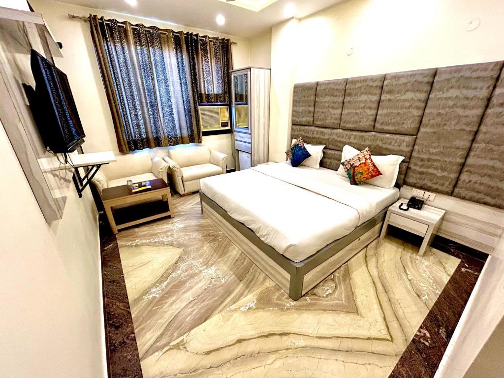 Postel nebo postele na pokoji v ubytování Hotel Amrit Villa