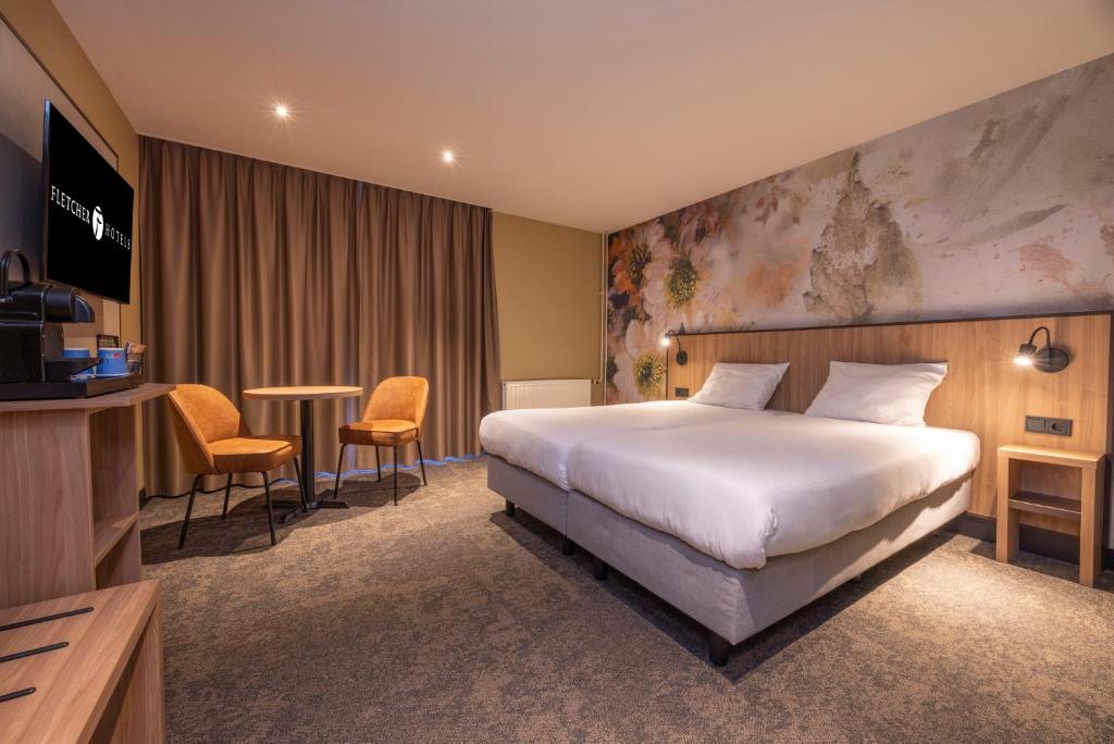 Postel nebo postele na pokoji v ubytování Fletcher Hotel-Restaurant Klein Zwitserland